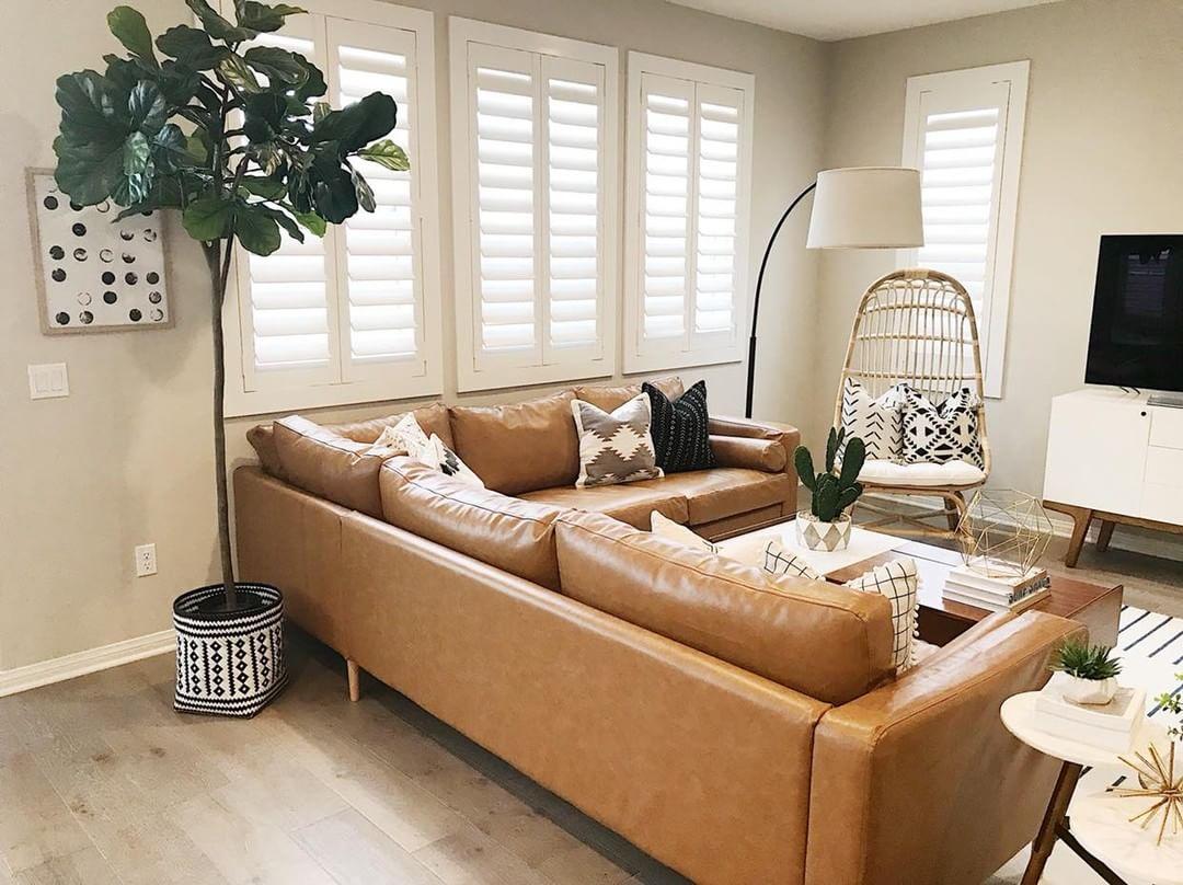 Warm living room with our Polywood shutters in Orlando.